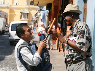 Eddie explaining to the vendor that his skills are not suffecient for the flute. Loyce and Susan in background.Photos by TOM HART