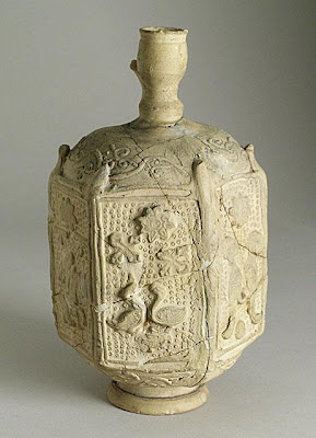 Bottle | Origin: Syria | Period: 12th-13th century | Collection: The Madina Collection of Islamic Art, gift of Camilla Chandler Frost (M.2002.1.94) | Type: Ceramic; Vessel, Earthenware, molded with applied neck, foot and handle (now missing), Height: 7 3/4 in. (19.68 cm)