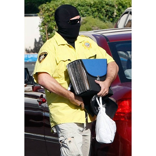 DEA Agents Search The Vegas Home and Office Of Michael Jackson's Doctor...LAS VEGAS - JULY 28: A Las Vegas Metropolitan Police Dept. officer leaves Global Cardiovascular Associates Inc., the medical office of Michael Jackson's personal physician Dr. Conrad Murray, after Las Vegas and Los Angeles police and federal Drug Enforcement Administration agents searched it July 28, 2009 in Las Vegas, Nevada. Authorities also searched Murray's Las Vegas home as they investigate Jackson's death. (Photo by Ethan Miller/Getty Images)