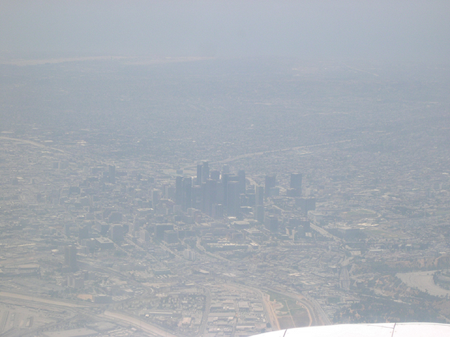 Aerial view of urban smog settling in and around central Los Angeles. Photo: Terry Lathem / NASA