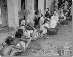 Women & children waiting for food in ration line after bloody rioting between Hindus and Muslims