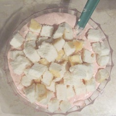 strawberry dessert mixing in the angel food cake