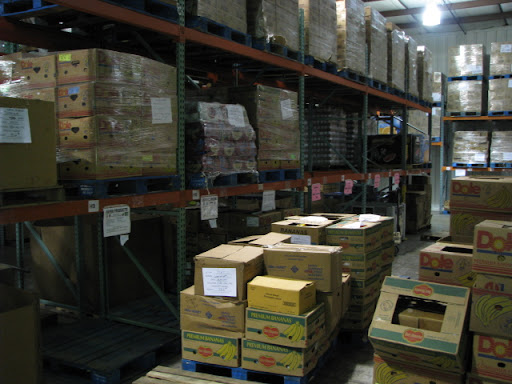 The Ozarks Food Harvest warehouse holds many crowded aisles of food awaiting swift delivery to the needy. (photo credit: Sam Senovich)