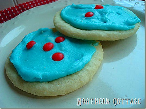 frosted cookie with red hots
