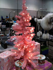 The backstage area at the show was decorated for the holiday season.  That poodle is almost as dressed up as the tree!
