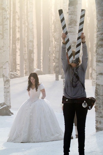 Lily Collins stands by as a large clapper board is used to mark the beginning of a scene, "Snow White," September 13, 2011