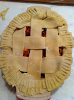 I added the lattice strips, tucked under, pressed, and crimped with a fork.