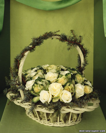 This unusual pairing features two items with similar budlike shapes: creamy-white roses and emerald-green ornamental kale. This unusual pairing features two items with similar budlike shapes: creamy-white roses and emerald-green ornamental kale.