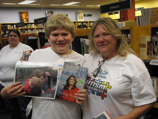 Cynthia Burington and her son Erik wait to see Palin. Erik met Palin last year at Bass Pro Shops.