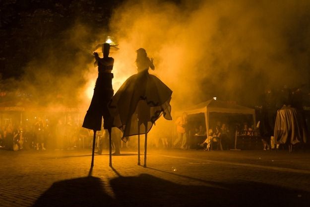 Spanish festival stilt walkers