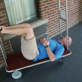 Yes, that's a hotel luggage cart.  No, we're not sure why he did it.