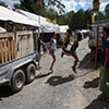 Festival shop staff hard at work pulling down the shop