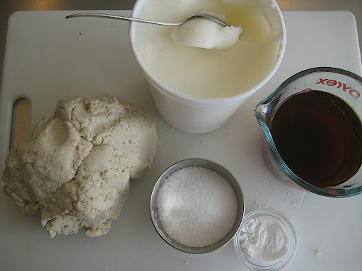 Ingredients needed to make the finished dough. Corn masa, lard or shortening, stock/broth or water, baking powder and salt.