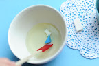Step 5: Remove the wax from heat, and add the candle color of your choice. We, of course, chose powder blue.
