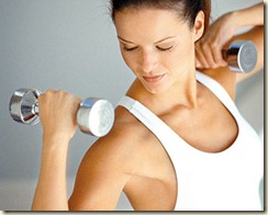 ca. 1999 --- Woman Exercising with Weights --- Image by © Michael Keller/CORBIS