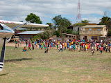 Along the way, we stopped in another town to drop off some other passengers, and here's the crowd that came out to see the plane on the small dirt landing strip. Madagascar6 - 066.jpg