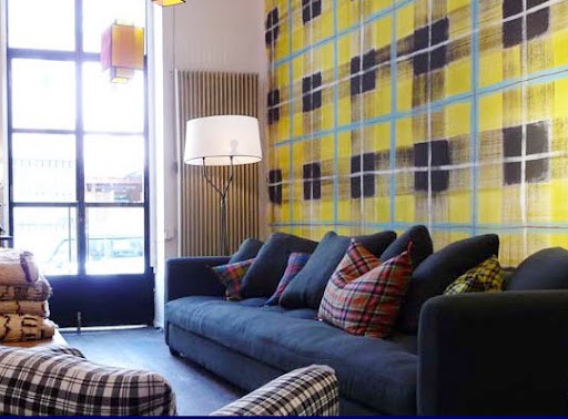 A modernized tartan print adds a flash of color to the room.