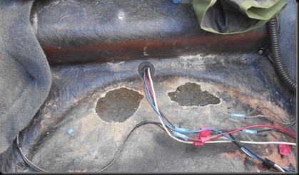 holes in bottom of Carl's trailer (wires already repaired)