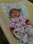This is the second picture of Audrey getting in a little outside time. She generally really enjoys being outside. If she's being really fussy, I can take her outside for a minute or two and it calms her down.
