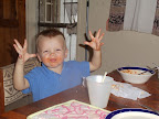 J enjoying his spaghetti. Quite the mess!