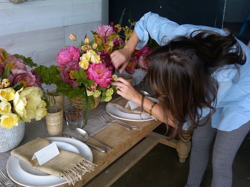 Livia works her magic on the centerpieces.