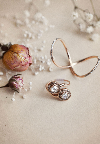 Jewelry designer Meredith Kahn's bridal collection includes the Delane ring (bottom), with two rose cut diamonds, and the white diamond Love Twist ring (top).