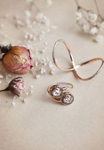 Jewelry designer Meredith Kahn's bridal collection includes the Delane ring (bottom), with two rose cut diamonds, and the white diamond Love Twist ring (top).