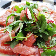 Baby Arugula and Walnut Salad in a Tomato Bowl