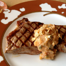 Persimmon Caper Seasoned Butter Dressing a Steak