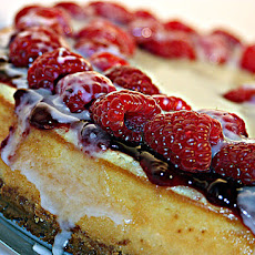 White Chocolate Cheesecake with Raspberry Sauce, Fresh Raspberries and White Chocolate Glaze