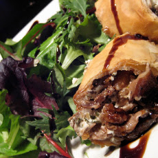 Wild Piedmont Mushroom & Goat Cheese Strudel served over Spring Arugula with toasted Pine Nuts