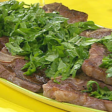 T-Bone Steaks with Chopped Green Garni, Broiled Tomatoes with Cheese, Olives and Herbs