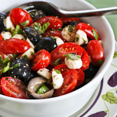 Tomato, Olive, and Mozzarella Salad with Basil Vinaigrette