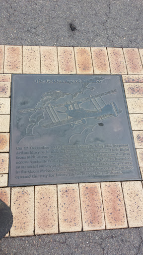 The Golden Age Of Aviation Plaque In Footpath