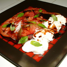Locally Grown Heirloom Tomato Salad with Fresh Burrata Cheese and Coppa.
