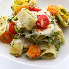 Baked Calamarata Pasta with Arugula Pesto, Almonds, Fresh Mozzarella & Cherry Tomatoes