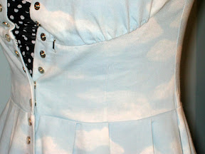 This is the only place a dart and a pleat actually line up correctly. Whatever. You can also see the some of the snap and fastener shenanigans in this pic