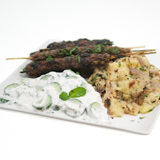 Ground Lamb Kofto Kebabs with Pomegranate Glaze, Bengali-Spiced Potatoes and Persian Cucumber Raita