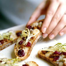 Frisée Salad with Blue Cheese, Walnut, and Cranberry Crostini