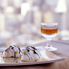 Snow Eggs with Pistachio Custard and Chocolate Drizzle