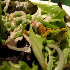 Mixed Green Salad With Freshly Shelled Peas and Edible Flowers