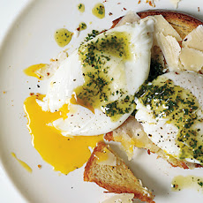 Poached Eggs and Parmesan Cheese Over Toasted Brioche with Pistou