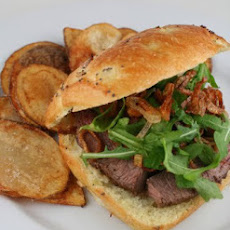 Horseradish Crusted Steak Sandwich with Arugula and Crispy Shallots