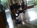 Javanese Man Touch the Head Dragon Statue