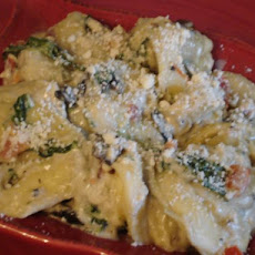 Sausage Ravioli With Sauteed Portabellas, Tomatoes, Spinach