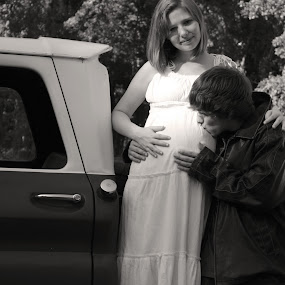 Kissing Baby by Chuck Gant - Portrait & People Couples
