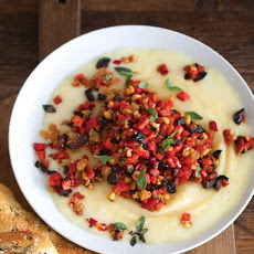 Warm Robiola Cheese with Pine Nuts, Olives, and Golden Raisins