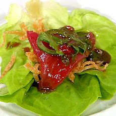 Fresh Tuna and Butter Lettuce Wraps with Crispy Wonton Threads, Shaved Jalapeno and Basil Oil
