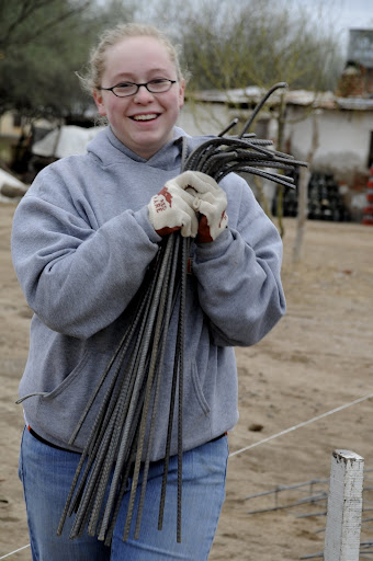 Shelby, from First Baptist Oak Grove, hauling rebar for the foundation.