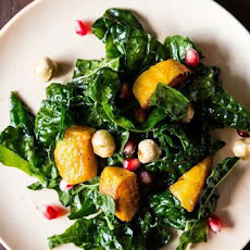 Hearty Kale Salad with Kabocha Squash, Pomegranate Seeds, and Toasted Hazelnuts